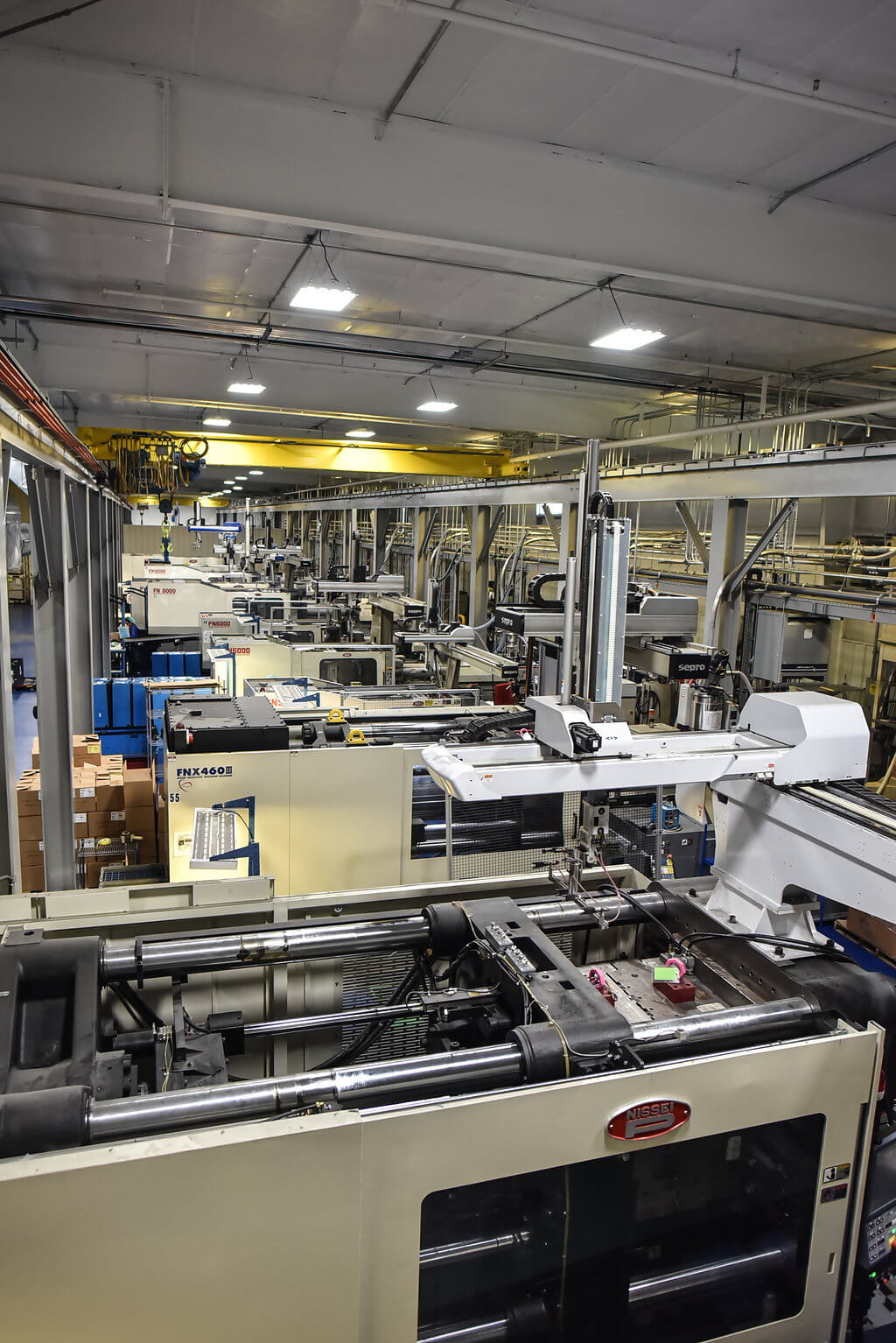 birdseye view of factory floor with injection machines