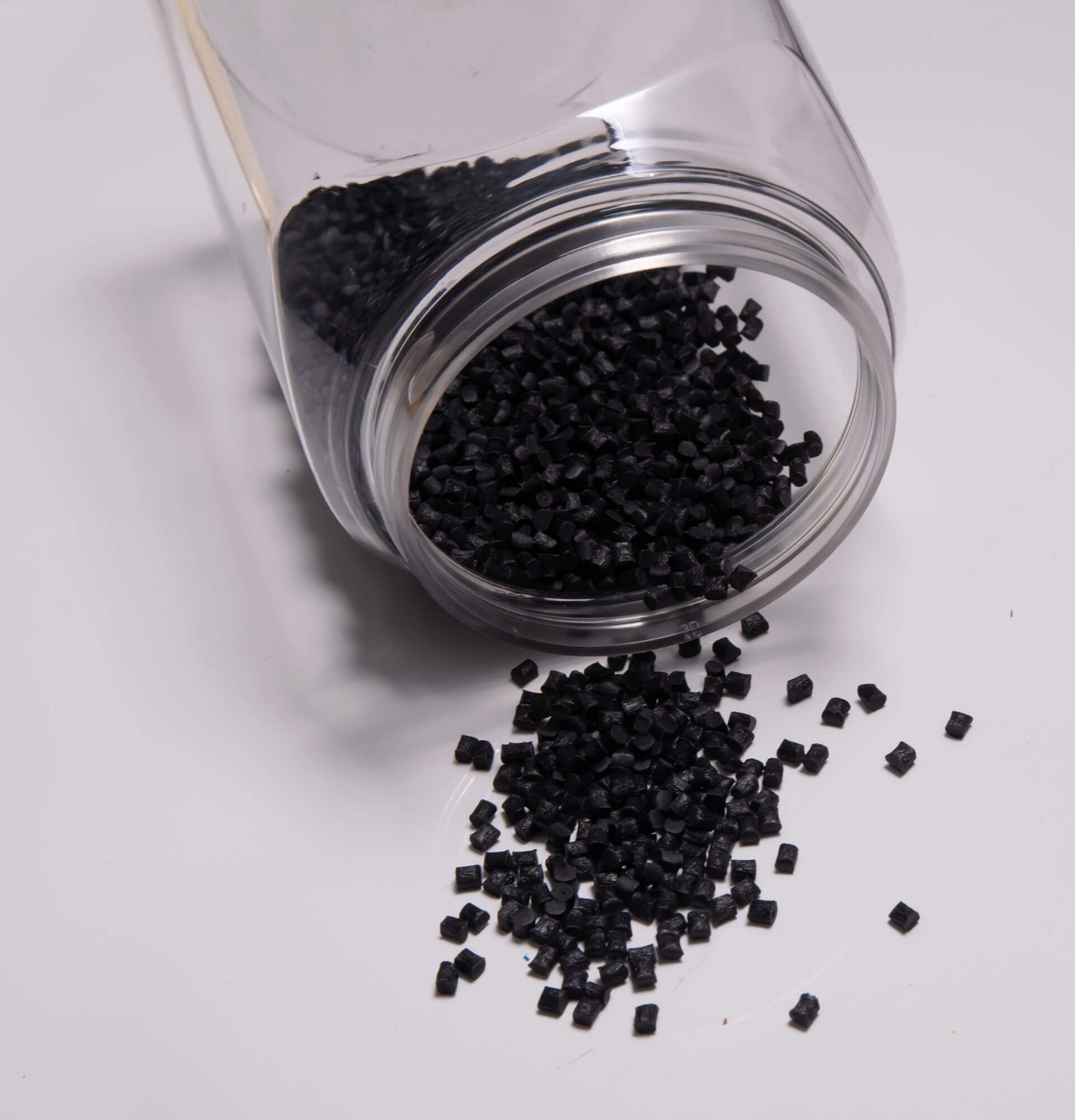 pile of injection molding resin pellets that is black