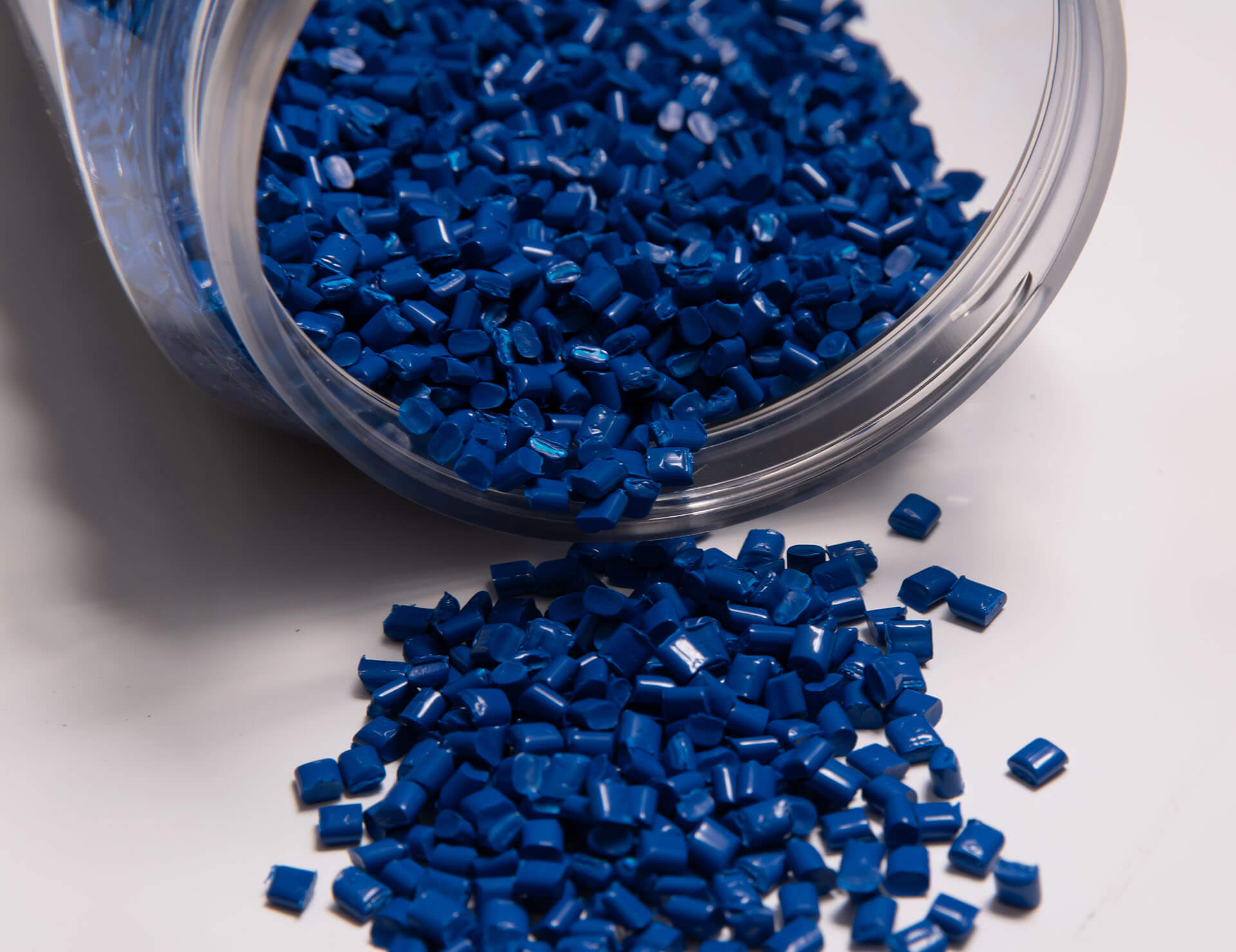 pile of injection molding resin pellets that is blue